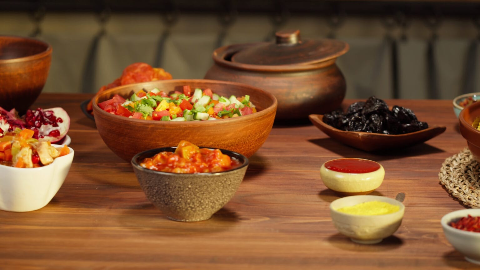 moroccan-cuisine-tajine-traditional-dish-made-of-lamb-and-eggplant-vegetable-salad-mid-SBI-350576812