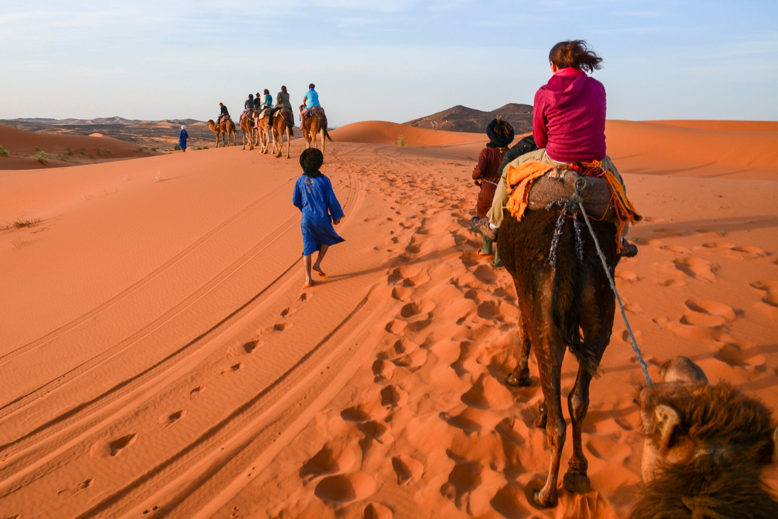 tourists on camels with guides in moroccan sahara 2026 01 07 07 13 55 utc scaled