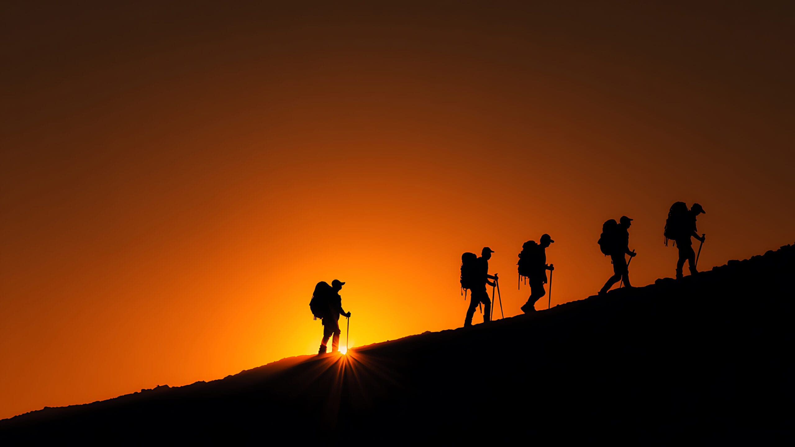 vecteezy silhouetted hikers ascend a ridge against a radiant orange 71784737 scaled
