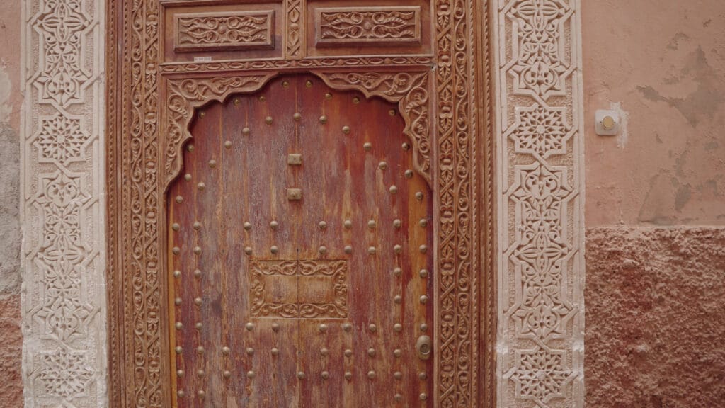 walking-in-a-beautiful-narrow-street-alleyway-of-medina-old-city-marrakesh-morocco-SBI-351142703