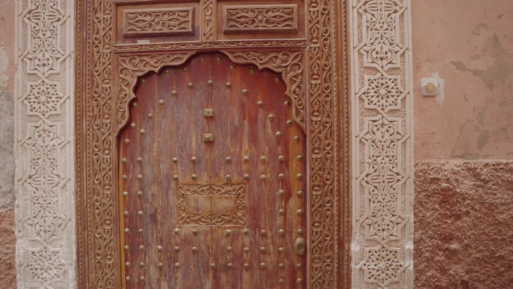 walking-in-a-beautiful-narrow-street-alleyway-of-medina-old-city-marrakesh-morocco-SBI-351142703