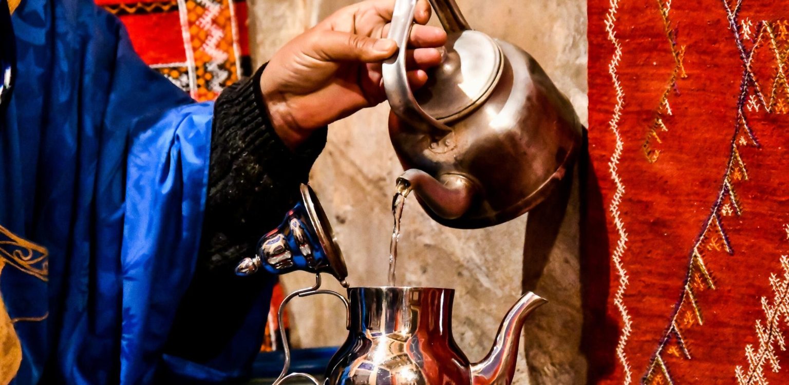 vecteezy_a-man-in-blue-robes-pouring-tea_33269658